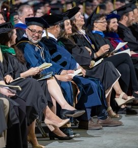 Faculty and staff await the start of commencement