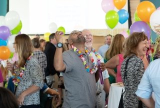 Faculty and staff members celebrate at an on-campus event