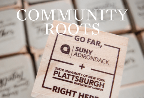 The cover of Community Roots magazine shows planter pots with a dual acceptance logo between SUNY Adirondack and SUNY Plattsburgh Queensbury