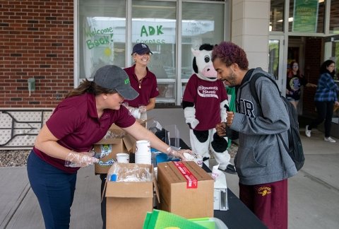 Stewart's Shops employees give out samples of Sweet Success, a SUNY Adirondack-inspired flavor