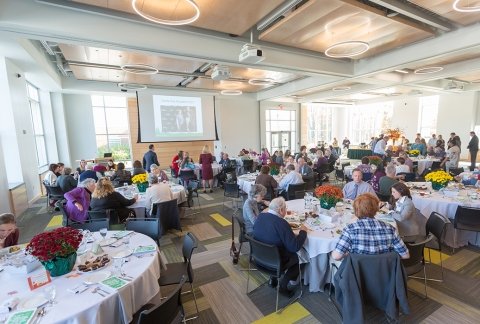 an event in the Northwest Bay Conference Center with round tables set up