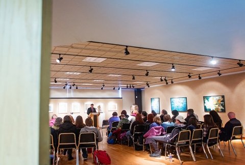 Visual Arts Gallery set up for an artists talk with an audience