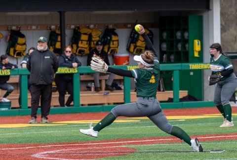 Pitcher on the women's softball team gearing up to pitch